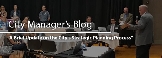 IMAGE OF MAYOR SPEAKING TO A CROWD