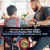 FATHER AND CHILD WITH CAPE SITTING AT TABLE
