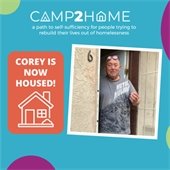 Cory in front of house