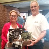 IMAGE OF MARRIED COUPLE WINNING RAFFLE PRIZE