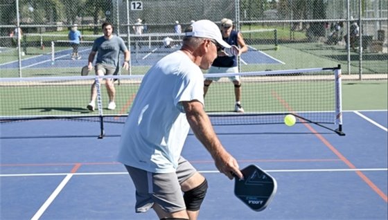 Modesto residents playing pickleball at a community park. 