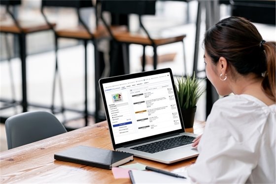 Photo of person looking at computer screen.