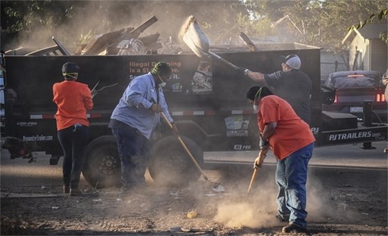 City Crews cleaning street. 