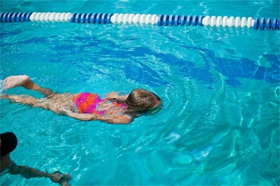 Photo of kid in swim lessons.